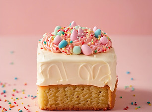 Close up photo of Small cake rectangle shaped with frosting and sprinkles.jpg