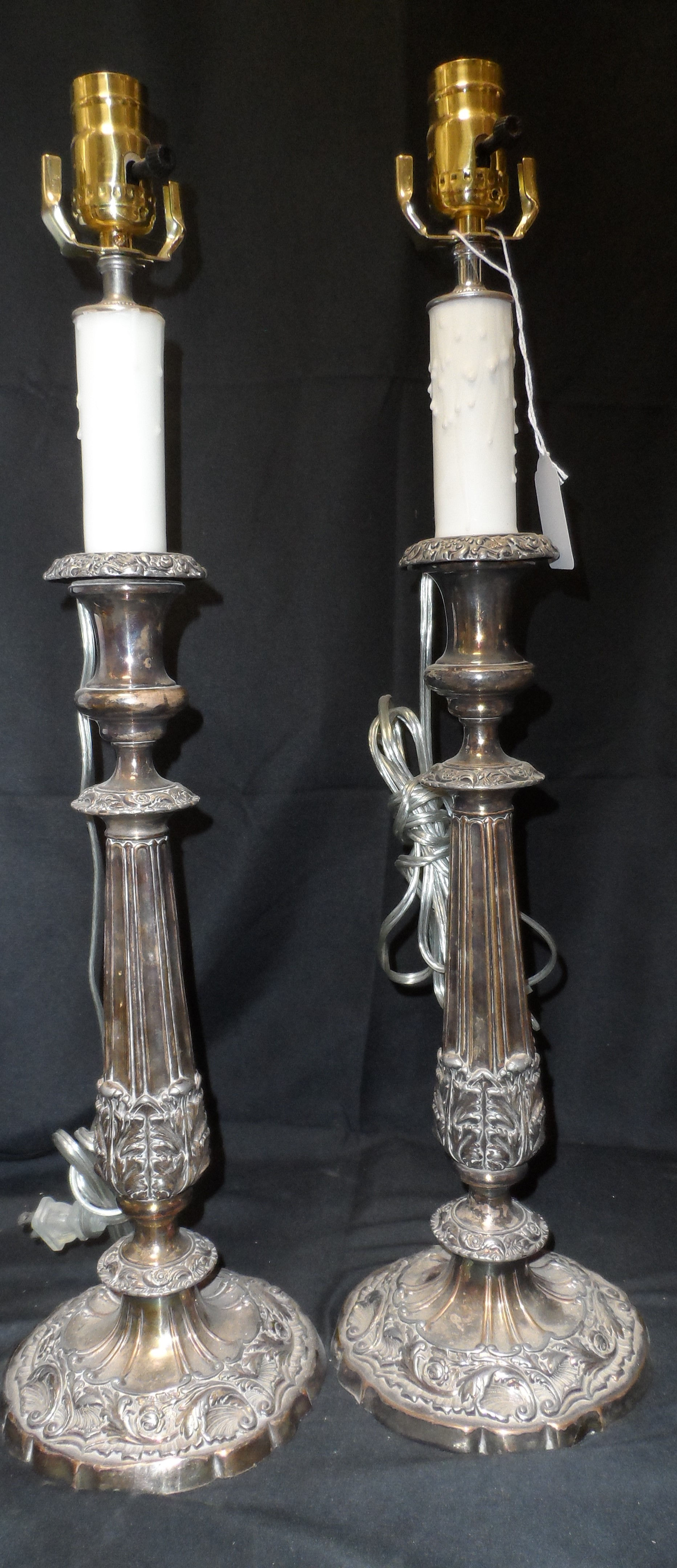 Pair of vintage brass candlestick table lamp with ornate base and fluted stem.