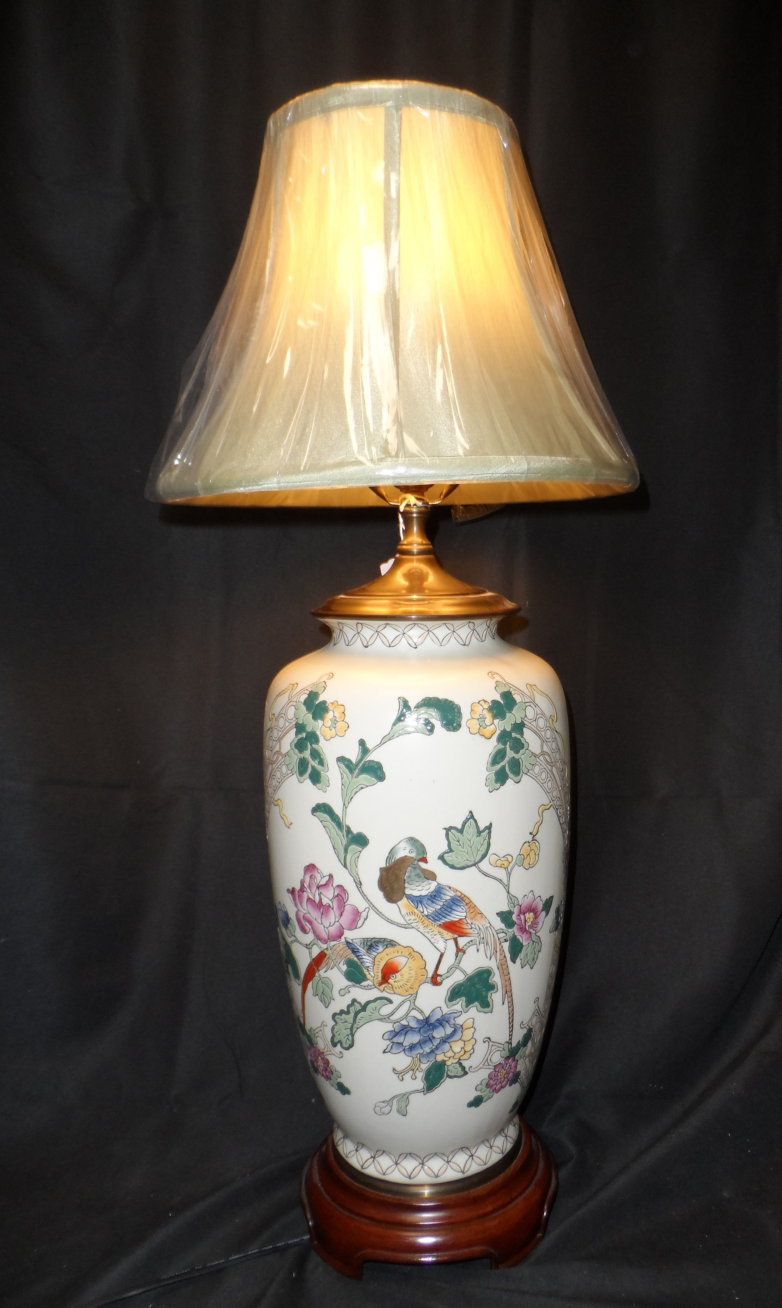 Vintage Chinoiserie style table lamp with painted birds and floral motifs.
