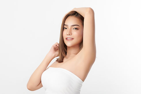 Beautiful Young Asian woman lifting hands up to show off clean and hygienic armpits or und