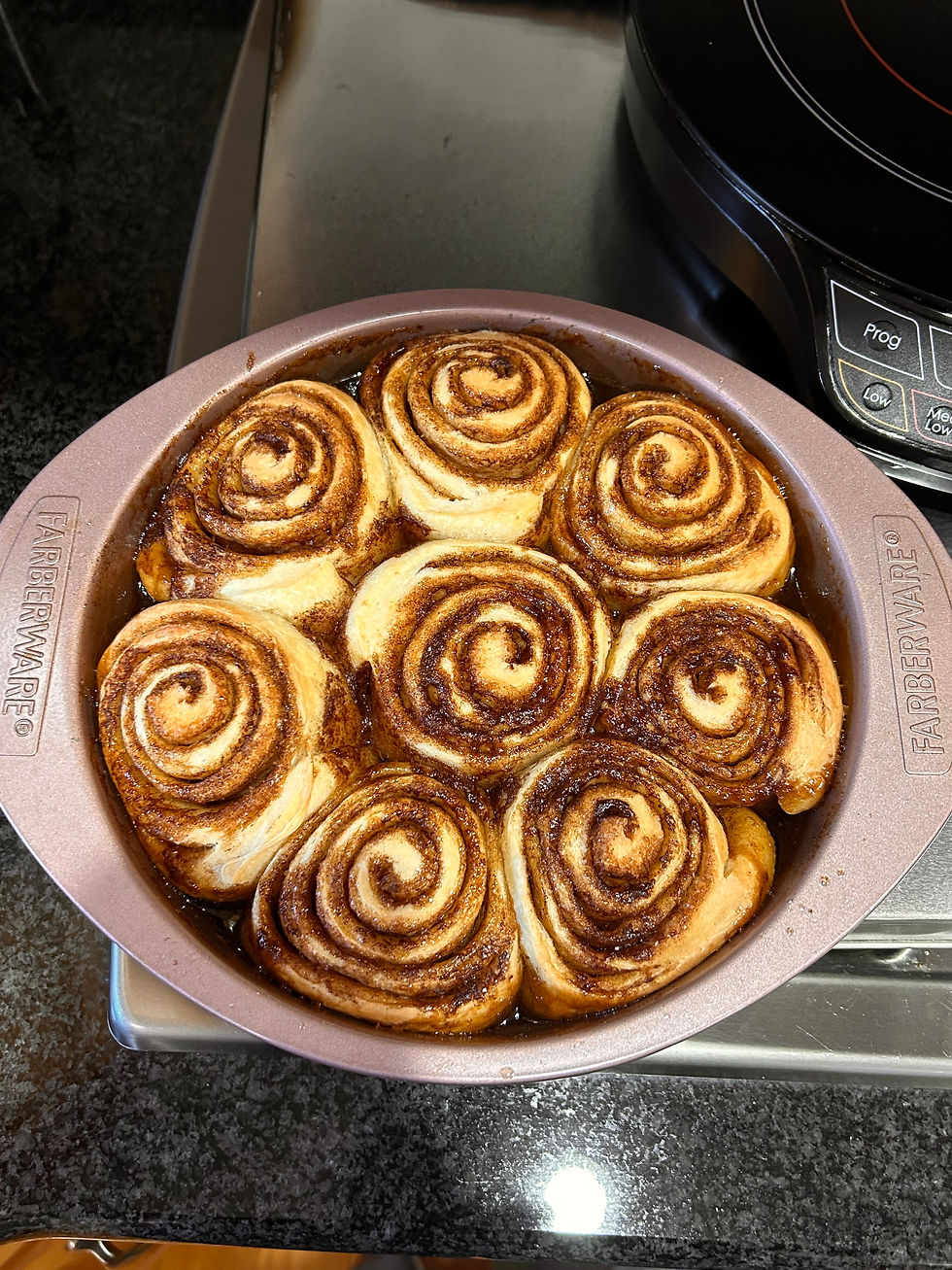 sourdough cinnamon rolls freshly baked on a tray
