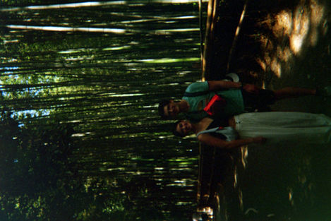 couple standing in Arashiyama Bamboo Forest smiling