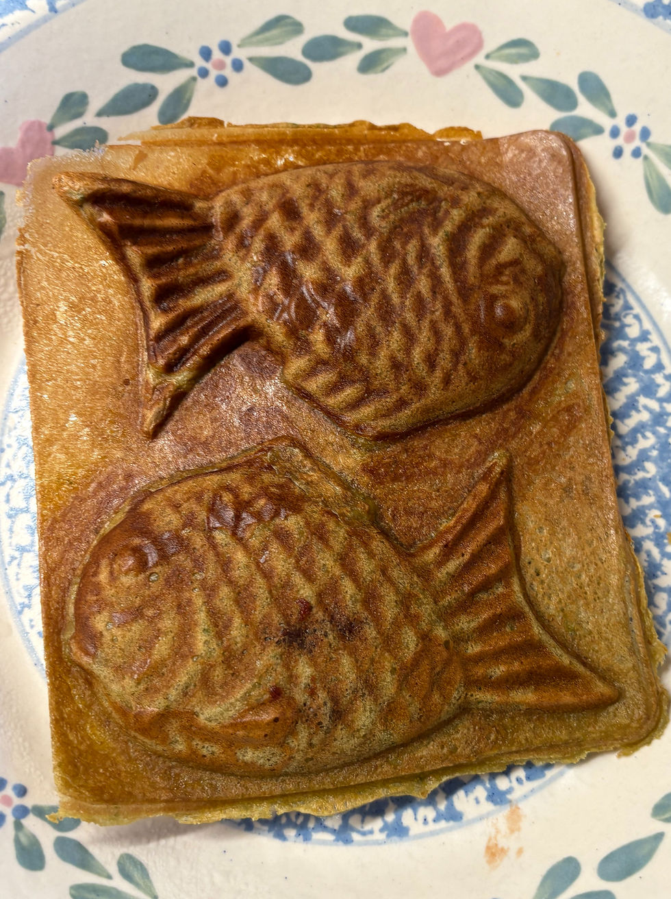 A crispy, golden Japanese fish-shaped cake filled with sweet red bean and scented with matcha.