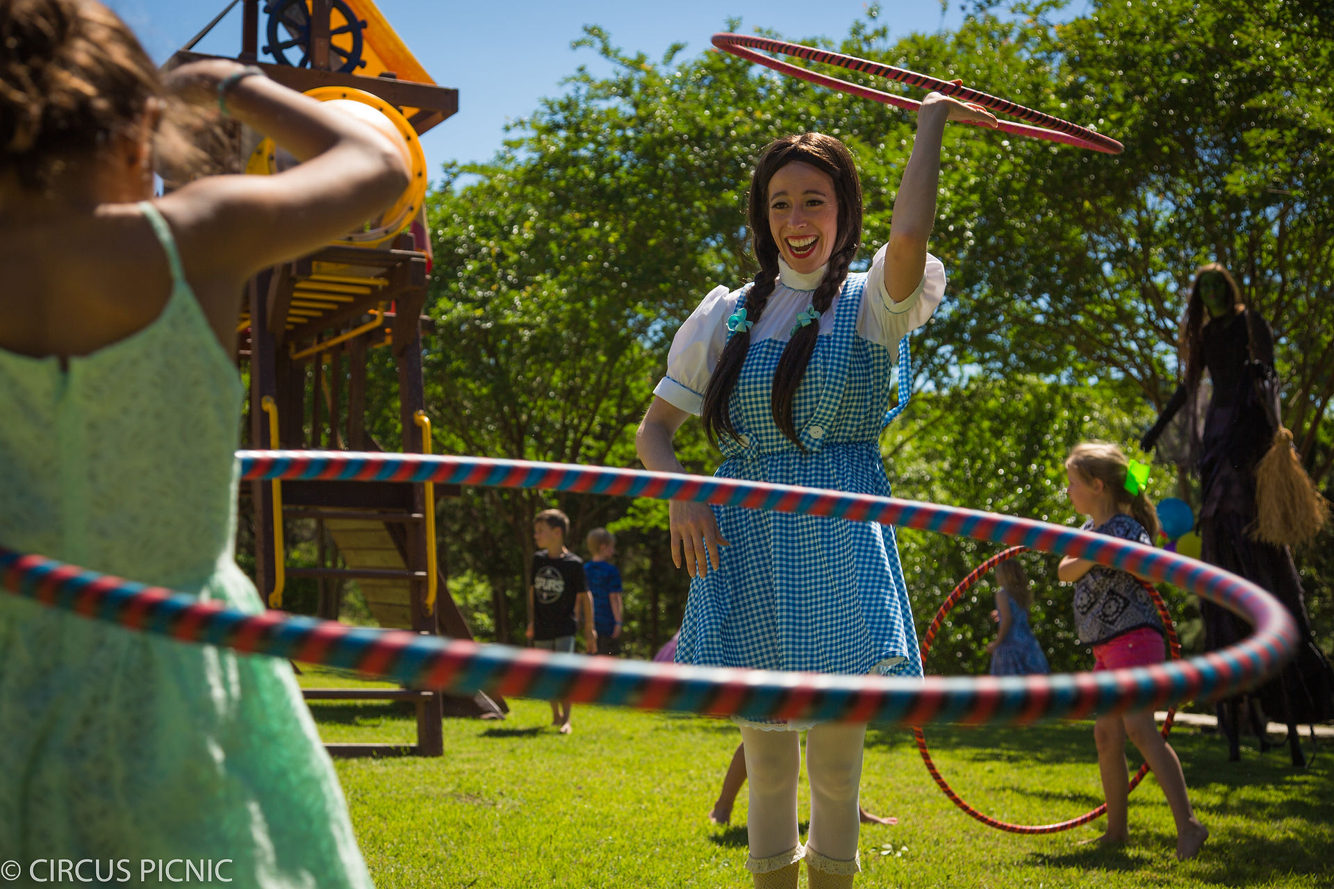 Dorthy is interactive with customers while hula dancing 