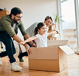 happy-daughter-having-fun-with-her-parents-while-relocating-new-apartment.jpg