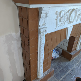 fireplace before paint with white details