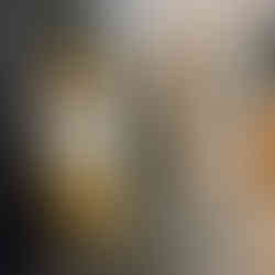 black and white finished brick fireplace with vase and candles