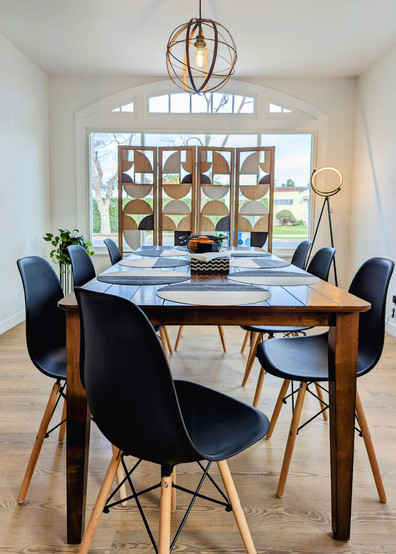 finished dining room featuring the original arched window