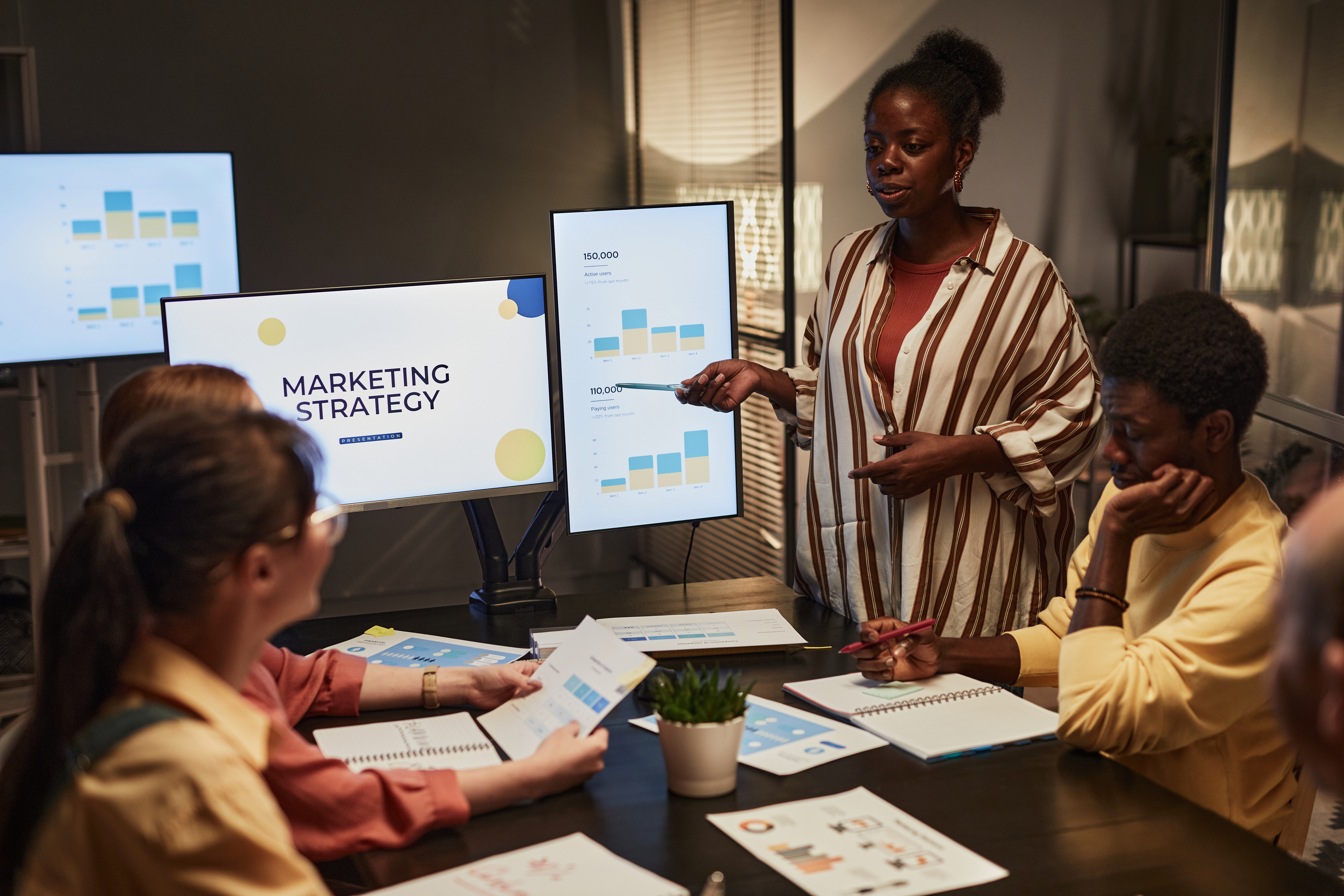 black-woman-presenting-plan-at-meeting-2025-03-05-23-10-33-utc.jpg
