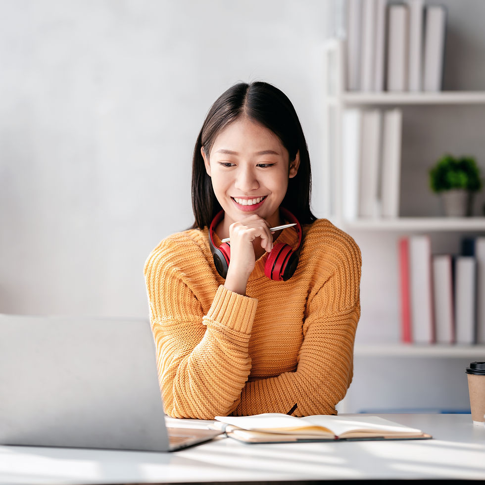 smiling-woman-studying-with-laptop-and-headphones-2026-01-05-05-23-10-utc.jpg