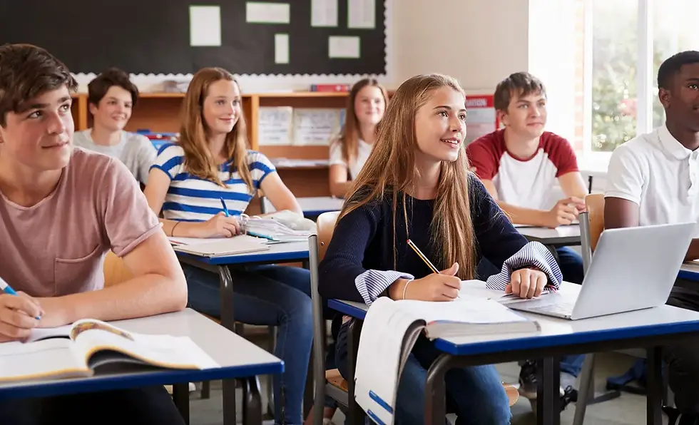 Diverse group of students in a classroom during a lesson.