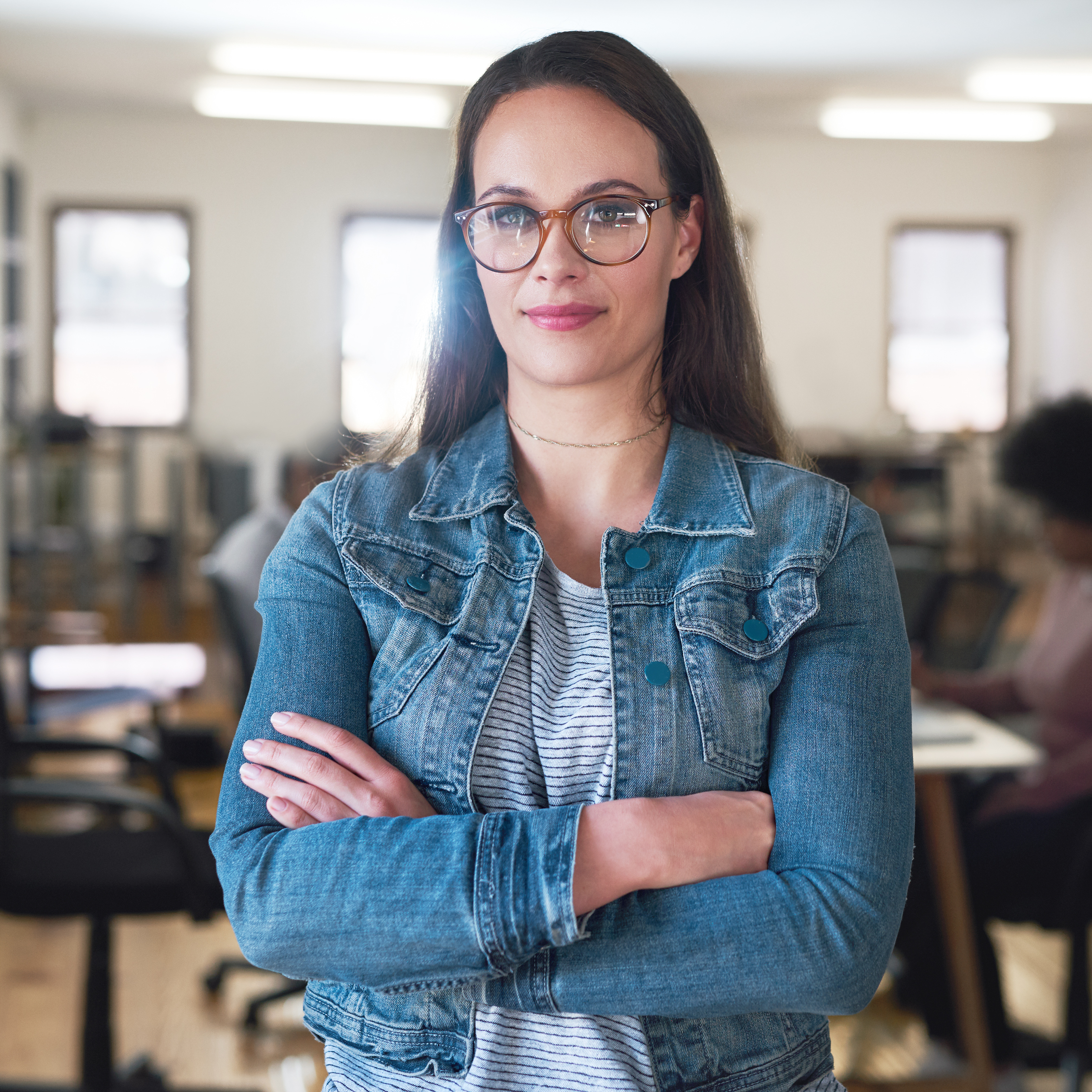 confident-woman-in-office-with-arms-crossed-2026-03-25-06-44-06-utc.jpg
