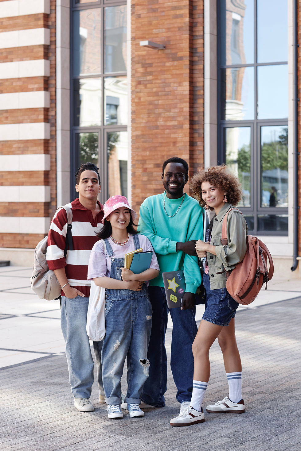 group-of-students-smiling-outside-brick-university-2026-01-08-07-30-54-utc.jpg