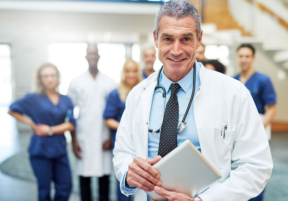 Healthcare administrator starting provider credentialing process with payer enrollment documents and onboarding checklist for a new physician hire