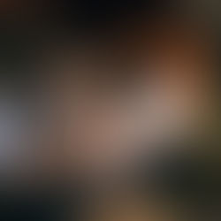 Group of professionals in a business meeting reviewing financial charts, graphs, and documents around a table — emphasizing collaboration, compliance, and strategic decision-making.