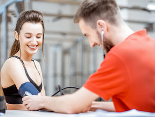 Healthcare provider assessing an adult’s mobility and functional performance