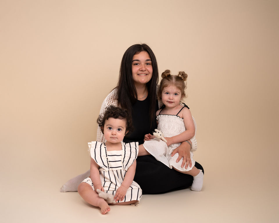 Mother sitting with her children during a natural family photography session