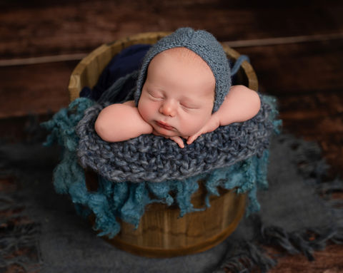 Newborn baby photographed in a calm studio setting in Swanwick, Derbyshire