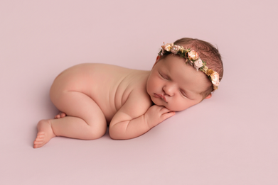 Professional newborn portrait on a soft neutral backdrop in Derbyshire