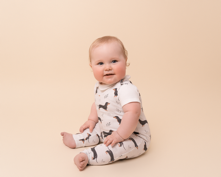 Baby sitting unaided during a relaxed family photography session
