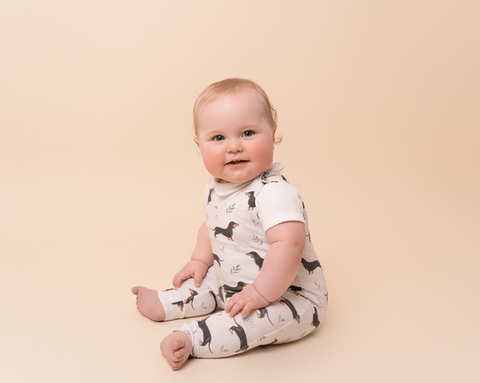Baby sitting unaided during a relaxed family photography session