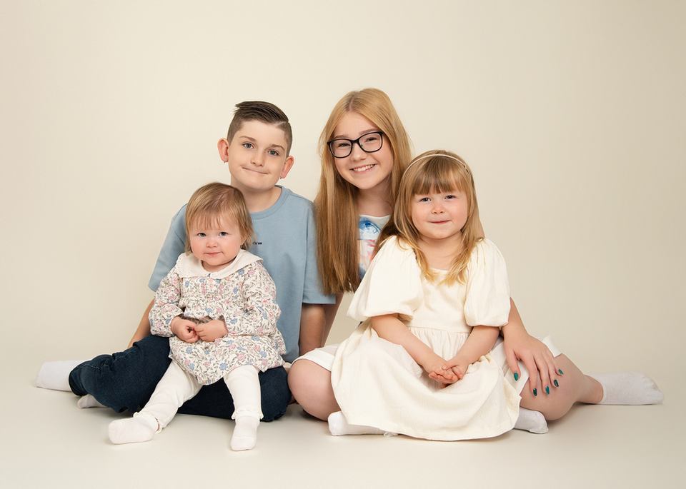 Family portrait with parents and young children at a Derbyshire family photography studio