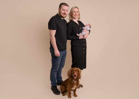 Family portrait with parents, baby and dog photographed in Derbyshire