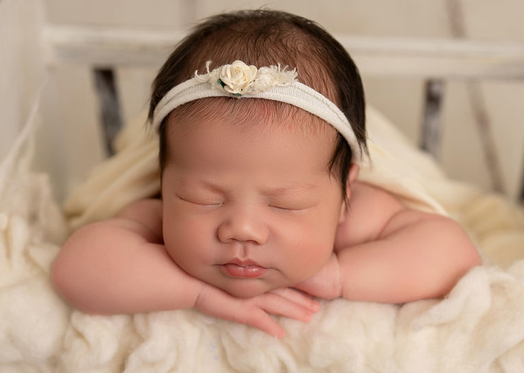 Close-up newborn portrait capturing peaceful early days in Swanwick, Derbyshire