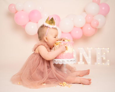 Cake smash photography session celebrating a first birthday in Derbyshire