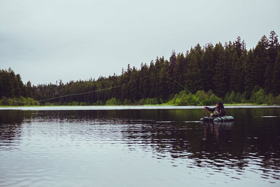 Fly Fishing cast from belly boat on lake in British Columbia while fly fishing for still water trout.