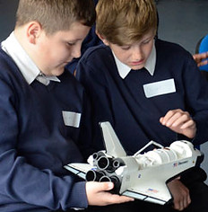 boys making rockets in our spaceman school workshop