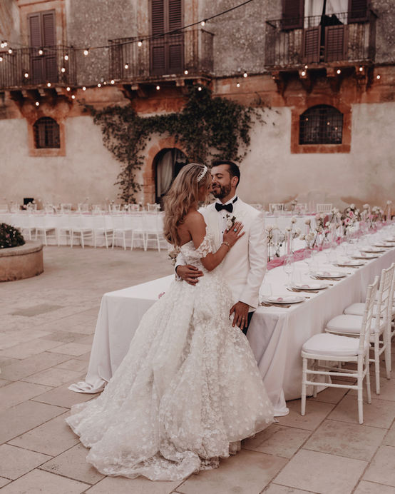 Romantic couple portrait at a wedding in Borgo del Carto, Sicily, with rustic, earthy, and timeless elegance