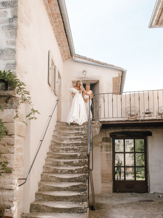 Candid editorial photograph of bridesmaids in joyful celebration at a French Provence wedding venue