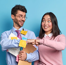 cheerful-mixed-race-woman-man-colleagues-celebrate-successfully-finished-work-make-fist-bu