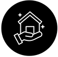 Hand holding a house icon inside a circle, representing the concept of home ownership.
