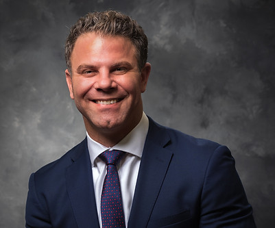 Craig Andriulli in a suit, possibly business portrait Fortress Mortgage Advisors.