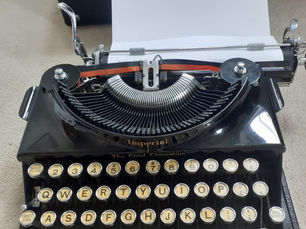 an old typewriter with a piece of paper in it