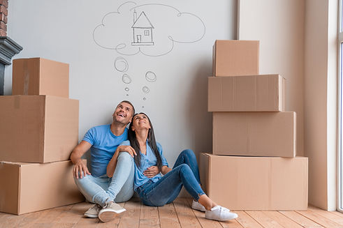 Young family with dreaming about moving into new house. Break, couple and happy in new hom