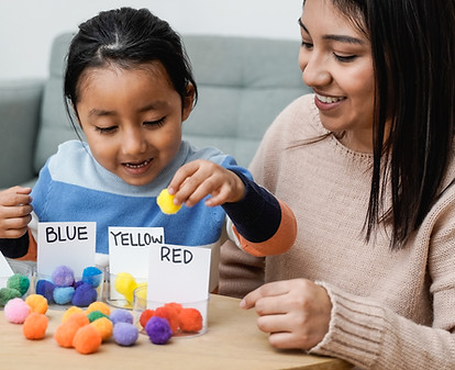 Photo of parent and child working on educational activity together.
