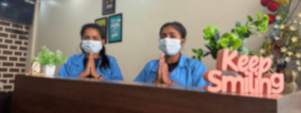 Clinic staff greeting the patients by doing 'Namaste'