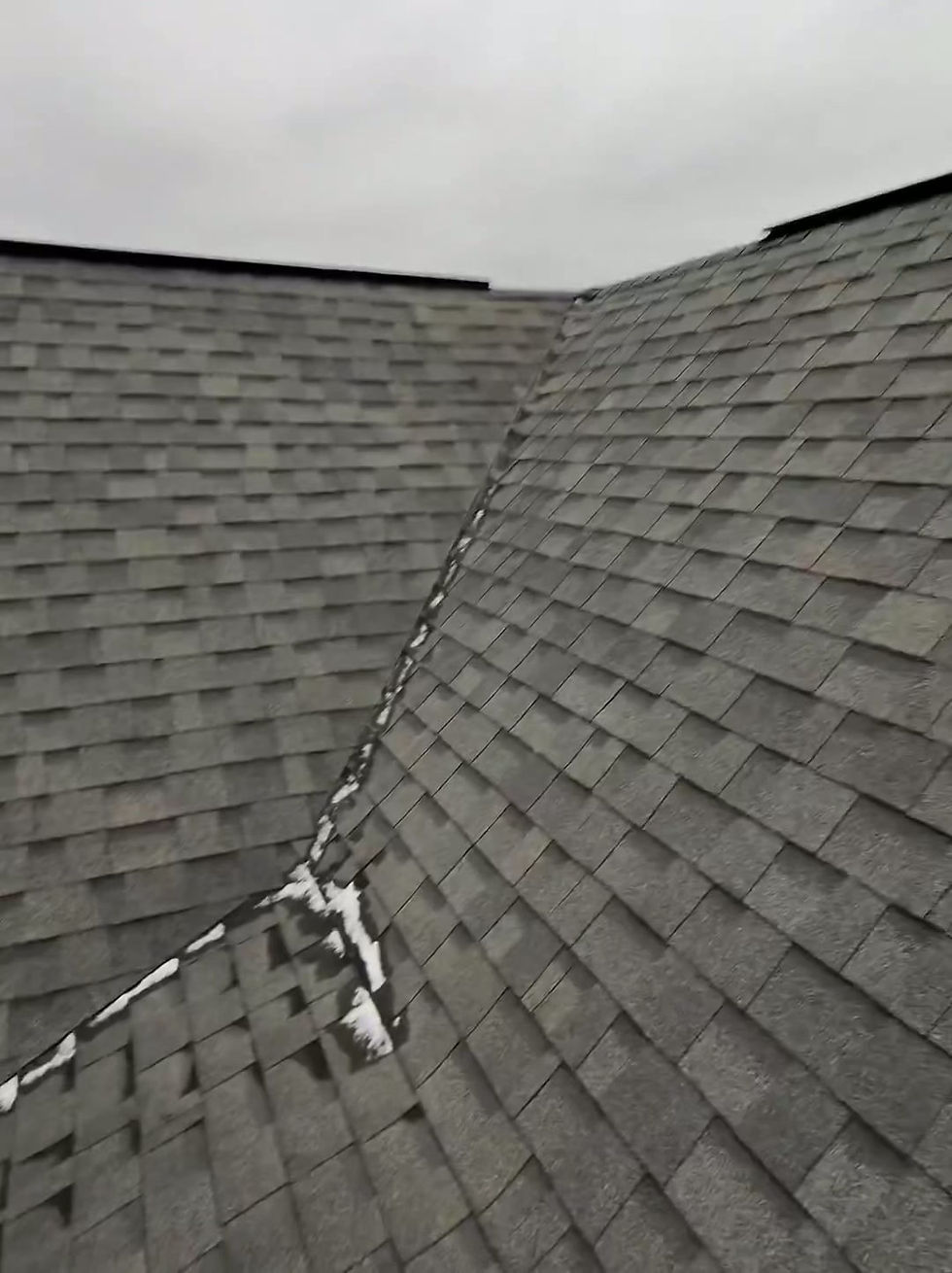 Aluminum ridge vent installed along the peak of an asphalt shingle roof
