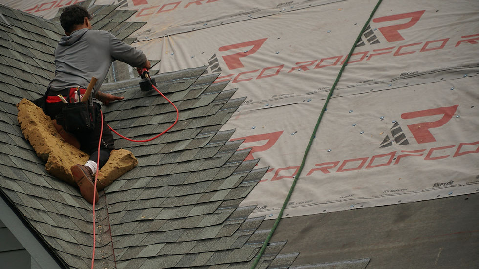 Close-up of architectural asphalt shingles being installed on a residential roof