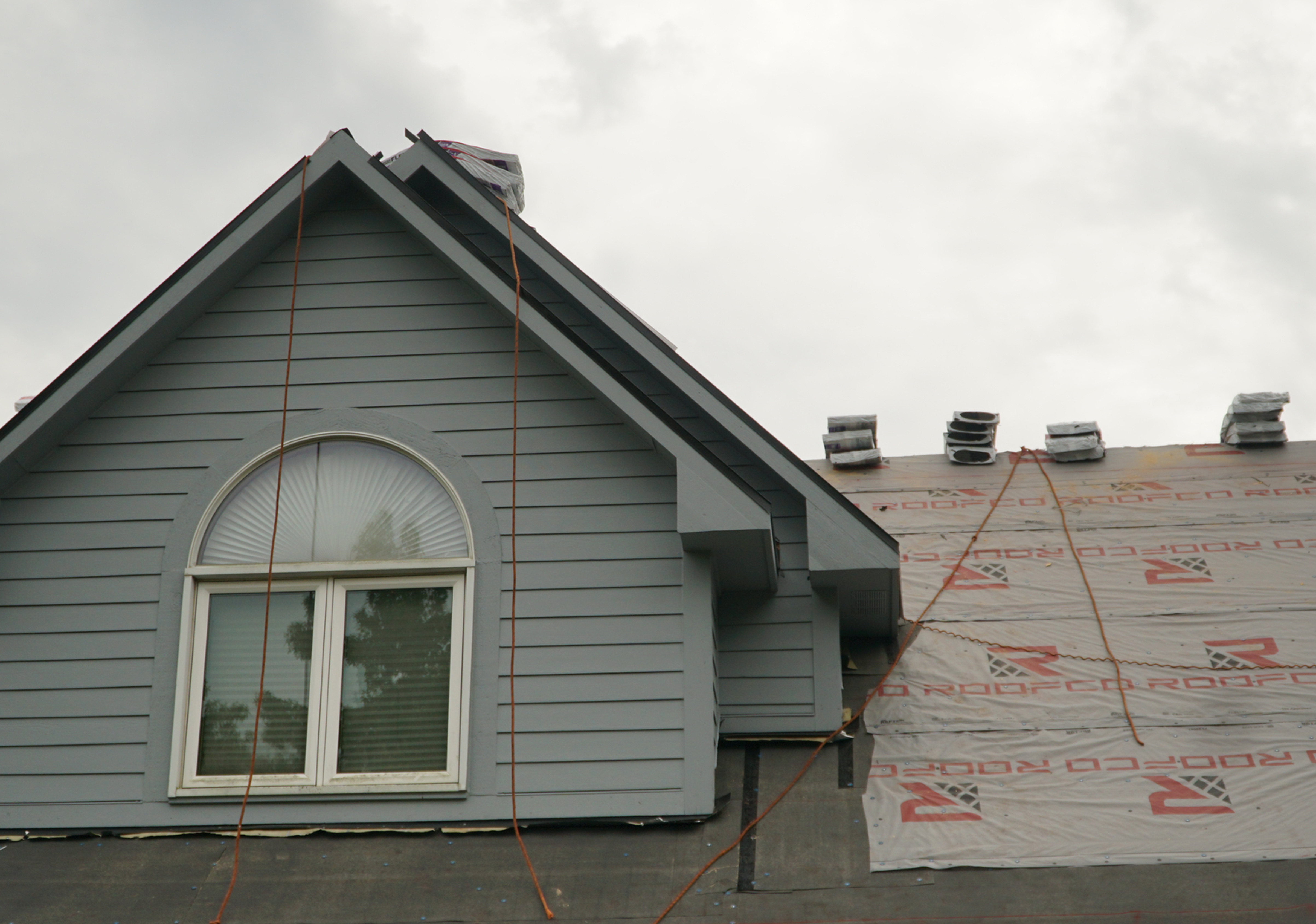 Front view of a Central Indiana home during the roof underlayment stage