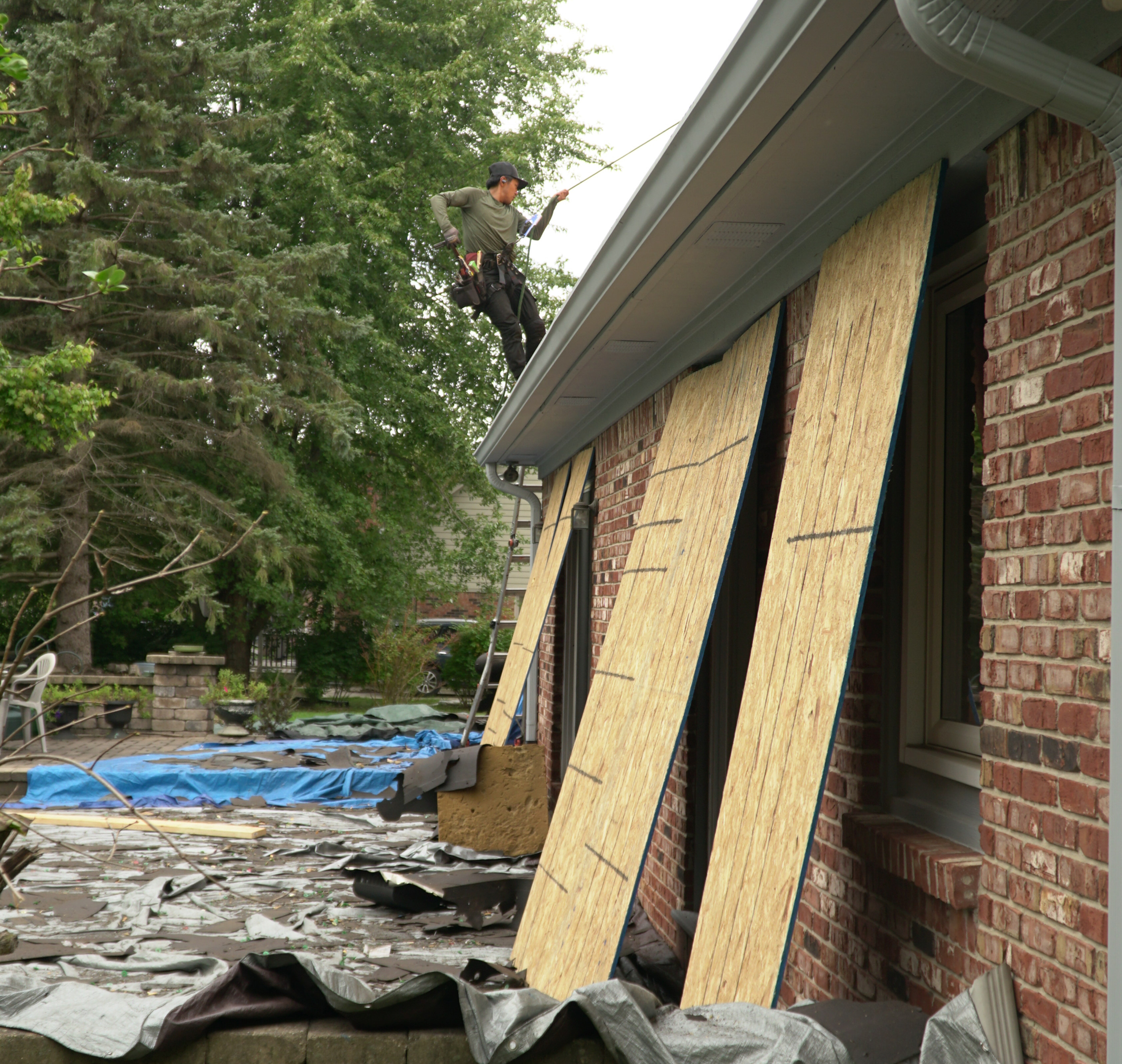 Window protection installed before roof replacement tear-off