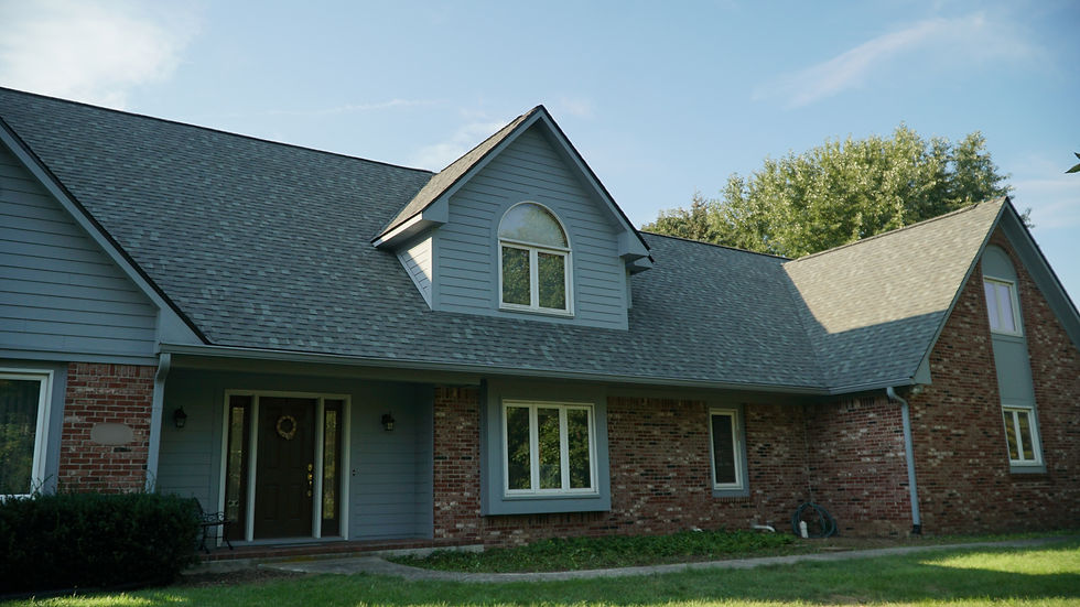 Completed architectural shingle roof on a brick Central Indiana home