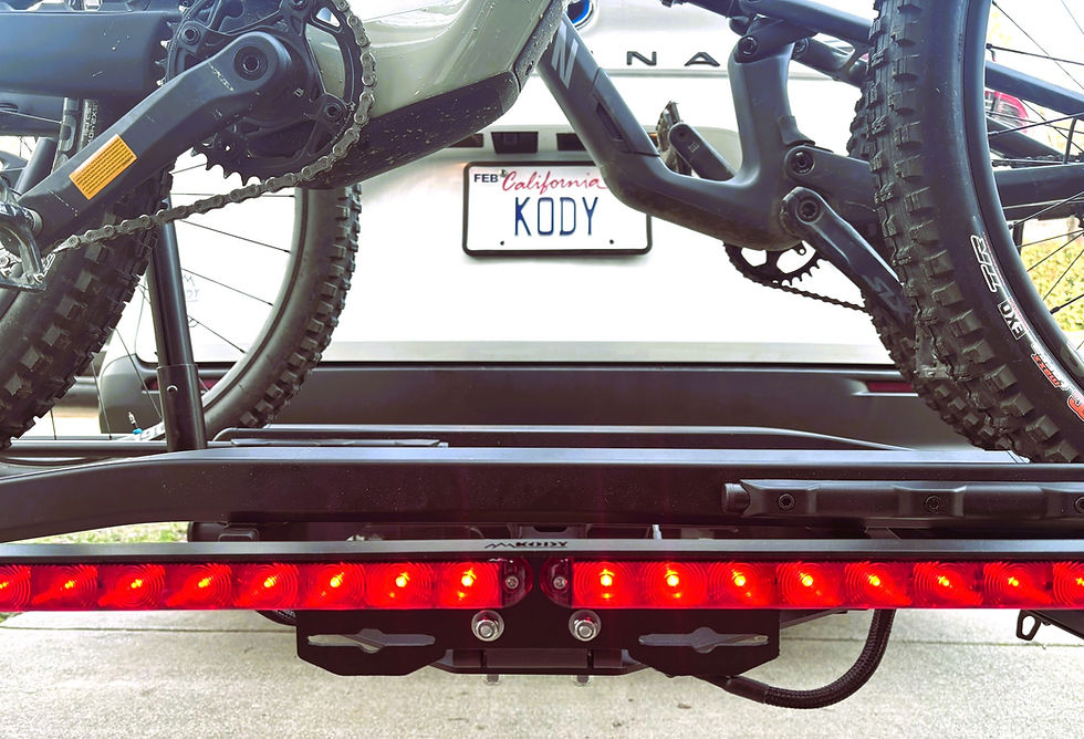 Thumbnail: Kody Technologies medium size bike rack light on a RockyMounts GigaWatt bike rack.