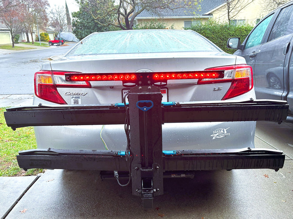 Thumbnail: Kody Technologies bike rack light on a RockyMounts GuideRail or AfterParty bike rack.