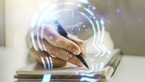 Hand writing in a spiral notebook, overlaid with glowing blue digital lines and circles, suggesting a brain and cognitive processes