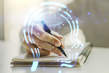Hand writing in a spiral notebook, overlaid with glowing blue digital lines and circles, suggesting a brain and cognitive processes