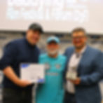 Allan presents 2025 Atticus Award for Best Documentary Short to Josh Kagi and Joe Gidjunis for their PBS series Grown Up Dad.